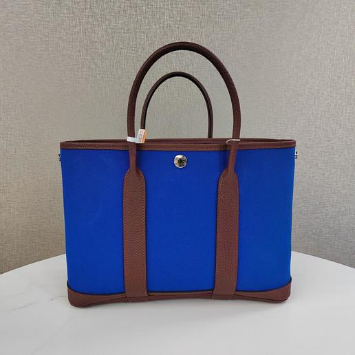 Hermes爱马仕花园30蓝色银扣帆布拼皮Z刻
成色:99新  配件:无配件